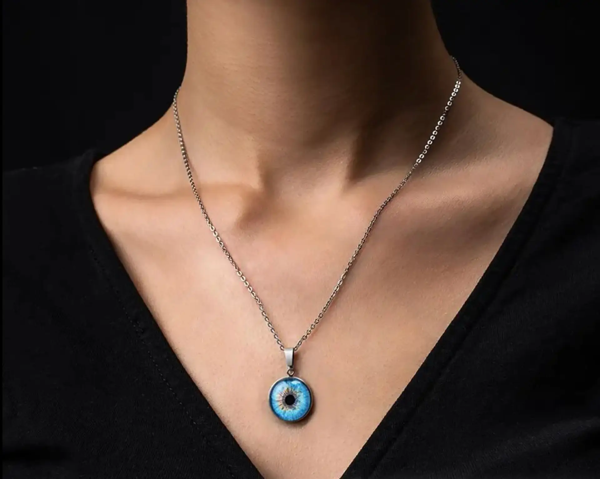 Elegant woman wearing a classy necklace with a custom iris pendant, showcasing refined style and personalized jewelry.